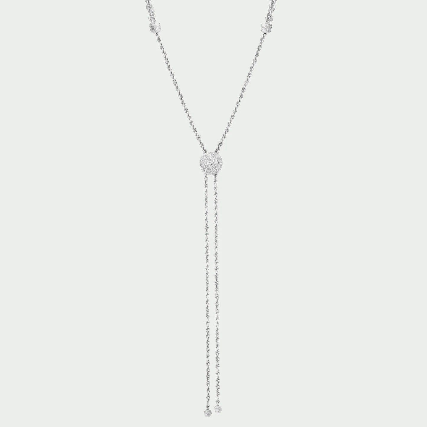 Silver necklace with a central pendant on a light gray background