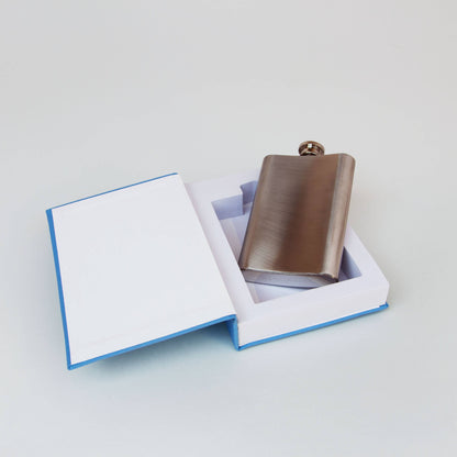 Brown flask in an open box on a light gray background
