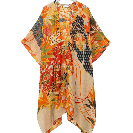 Colorful kimono-style garment on a hanger against a white background