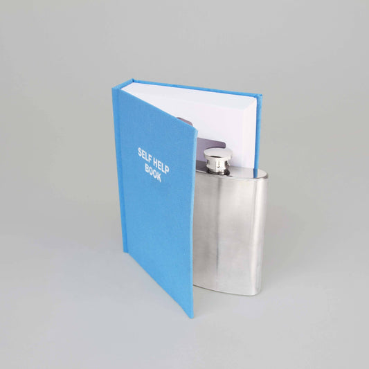 Self Help Book with a Flask tucked inside