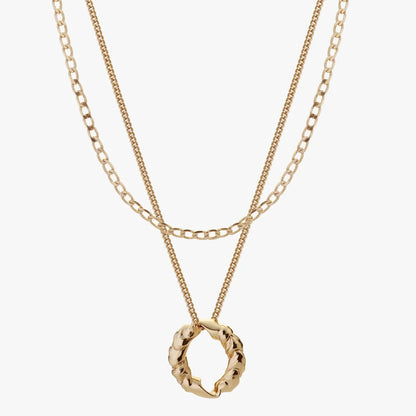 Two gold necklaces with circular pendants on a white background